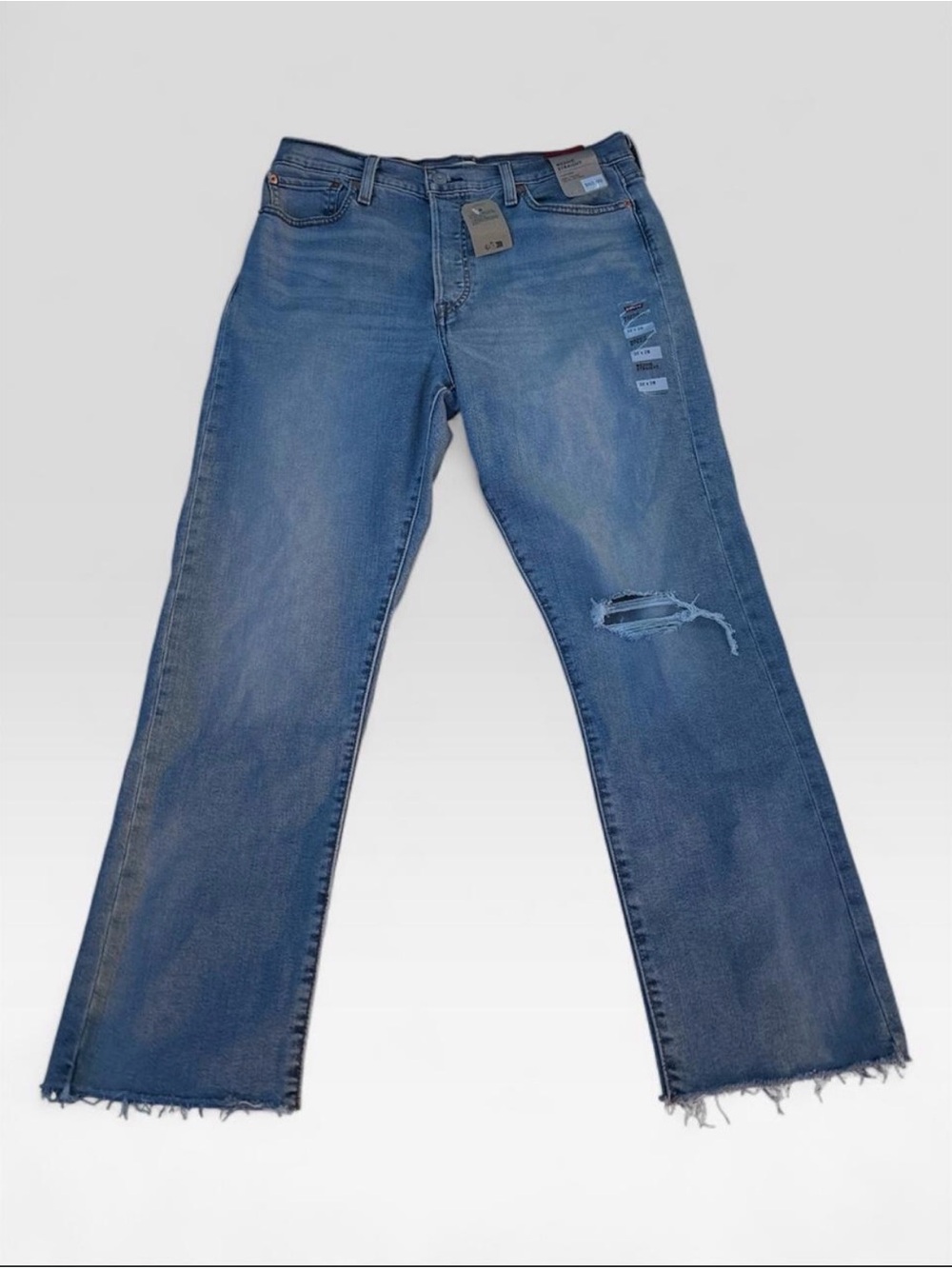 Levi's Women's Straight Leg Jeans in Light Blue with Distressed Knee